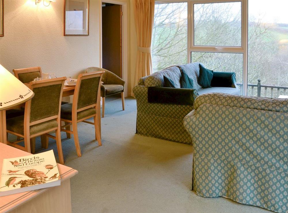Spacious living/ dining room at Honeysuckle Lodge in Woolfardisworthy, near Hartland, Devon