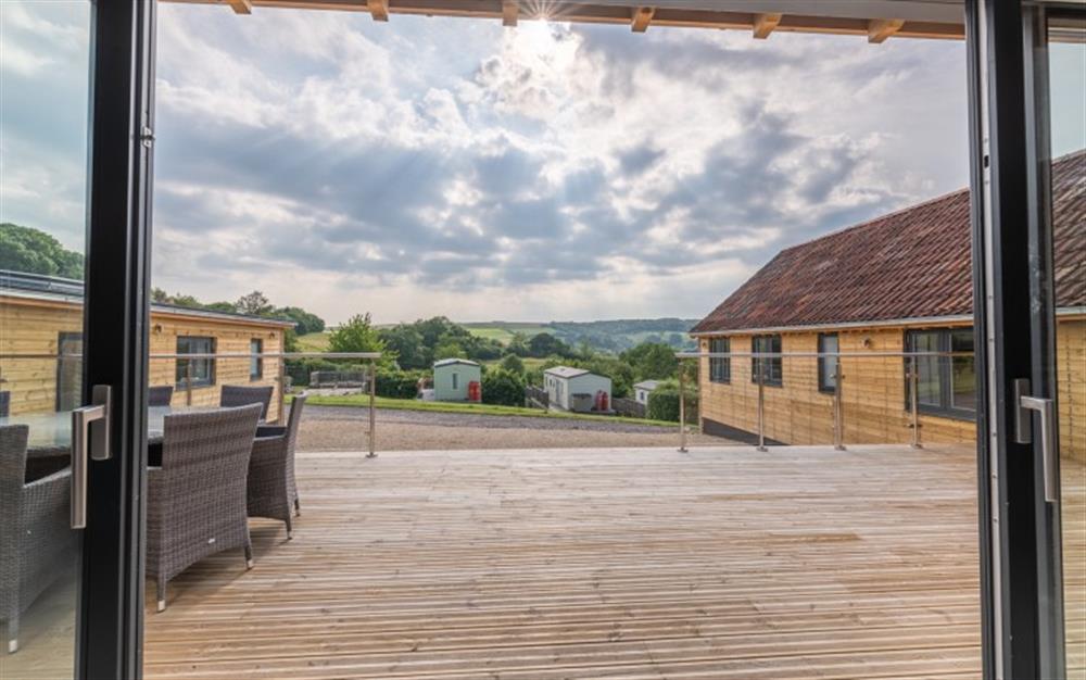 Decking with seating for 8 guests at Hook Farm in Lyme Regis