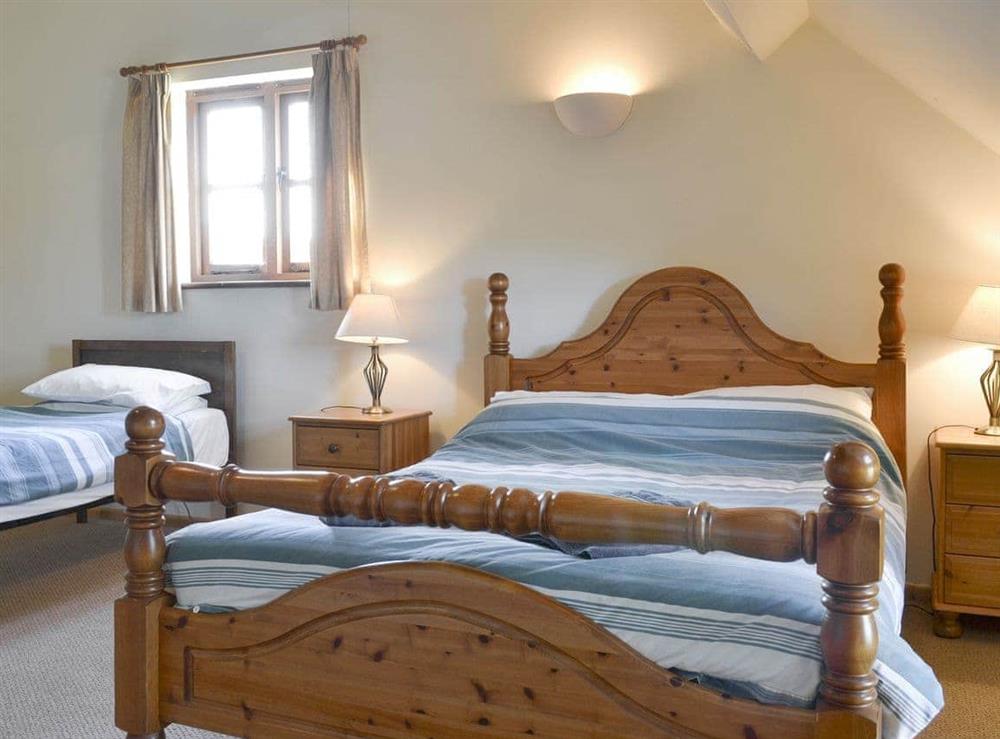 Restful triple bedroom with a double and a single bed at Hop Pocket in Bromyard, near Malvern Hills, Herefordshire