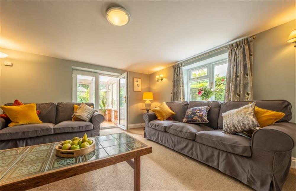 The sitting room has doorway access to the conservatory