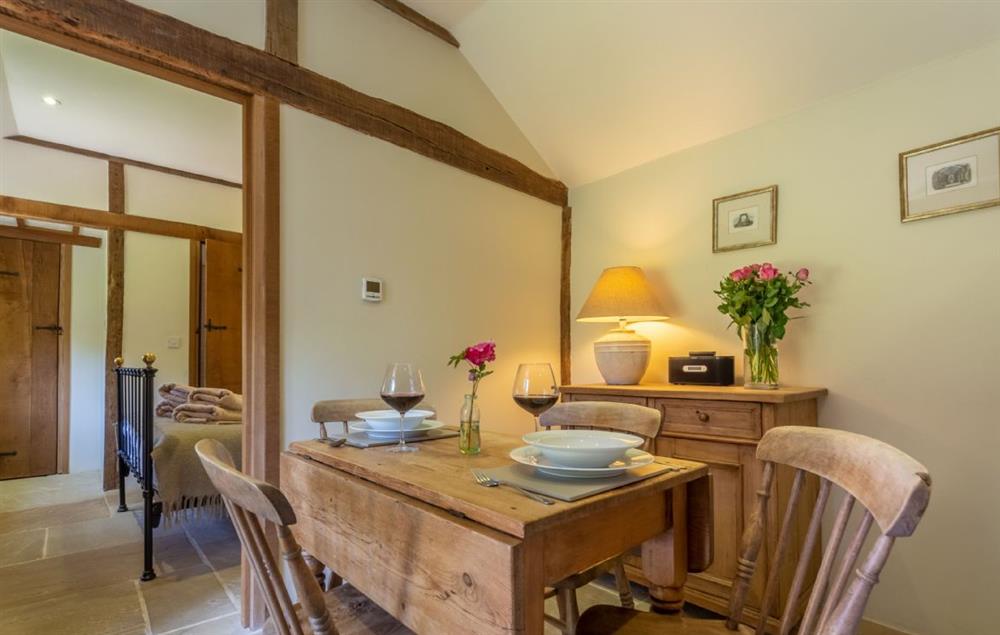 Fresh cut flowers adorn the dining area which seats four guests at Hope Cottage, Henfield