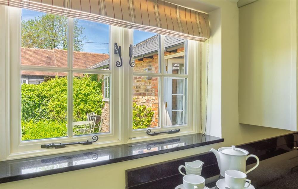 The beautiful view out to the garden from the kitchen window at Hope Cottage, Henfield