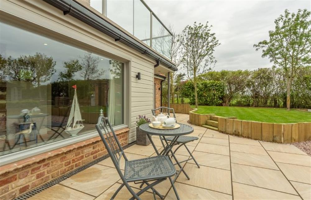 The paved terrace offers a great place for a relaxing coffee at Hope Cottage, Holme-next-the-Sea near Hunstanton