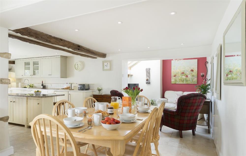 Open plan kitchen/dining room and snug at Hope Cottage, Quenington