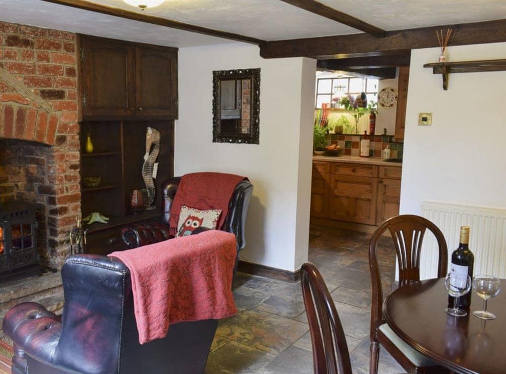 Dining room with sitting area leading to kitchen at Hope Cottage in Whitby, Yorkshire, North Yorkshire