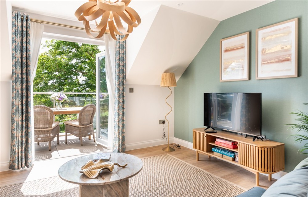 Relax in the living area at Hope Retreat in Thurlestone