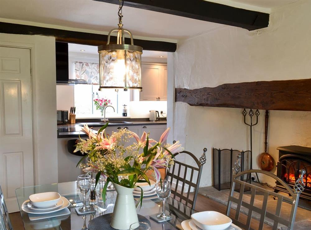 Dining area with feature inglenook fireplace at Hopedene Cottage in Weare, near Axbridge, Somerset