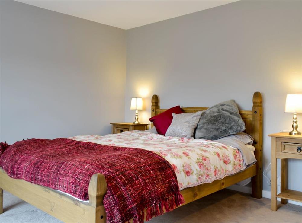 Master bedroom with kingsize bed at Hopedene Cottage in Weare, near Axbridge, Somerset