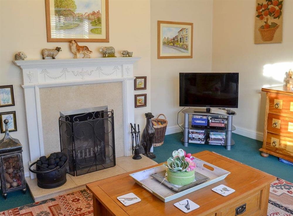 Comfortable living room with open fire at Horcum View in Lockton, near Pickering, North Yorkshire