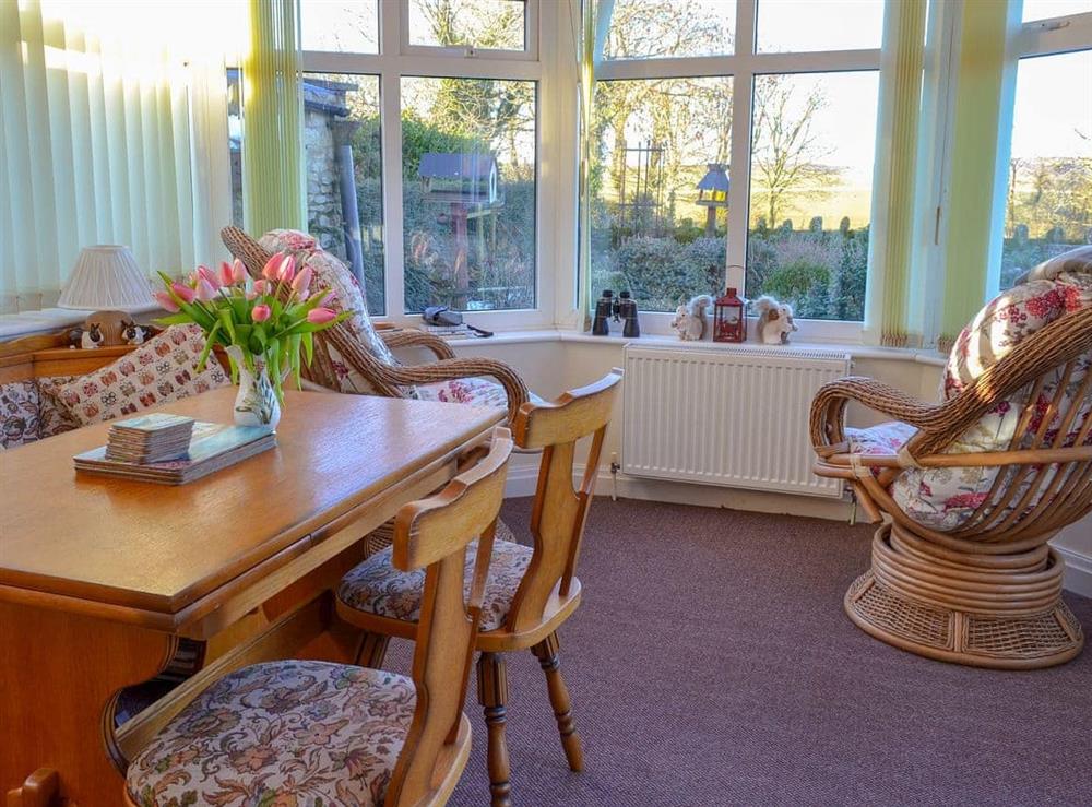 Conservatory with French doors leading to garden at Horcum View in Lockton, near Pickering, North Yorkshire
