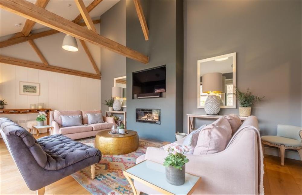 Cosy sitting room with modern wood burning stove