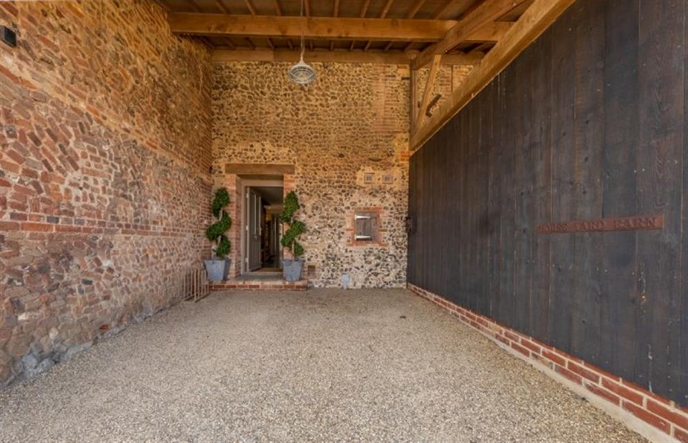 The car port gives a traditional barn feel at Horse Yard Barn, Norfolk at Horse Yard Barn, Warham