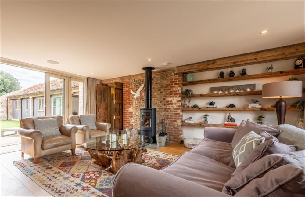 The family room with bi-folding doors leading to the garden at Horse Yard Barn, Warham