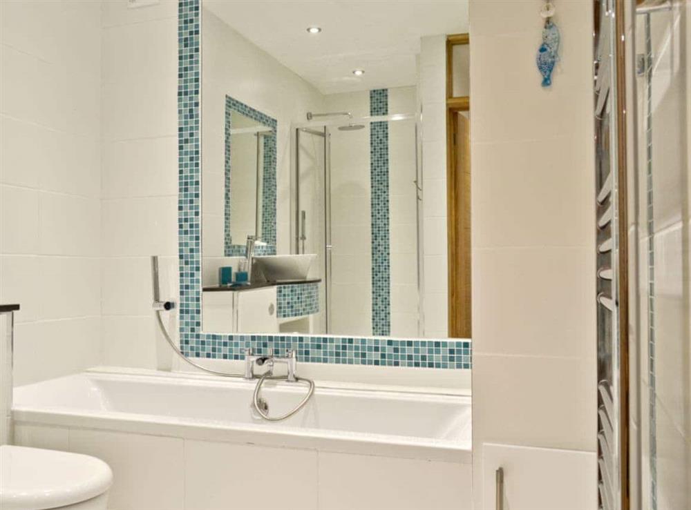 Additional bathroom with bath and separate shower cubicle at Florina, 