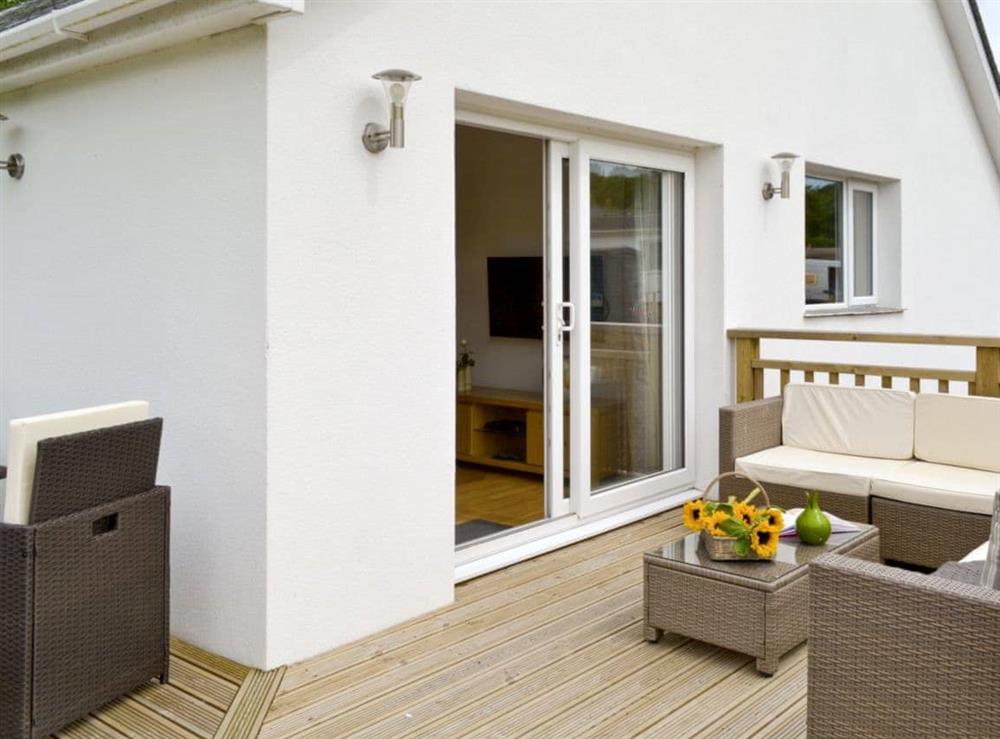 Decked terrace area with outdoor furniture at Florina, 