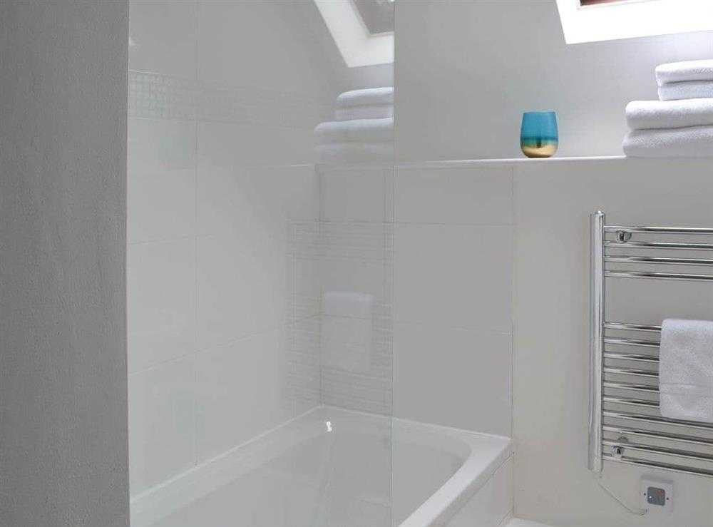 En-suite bathroom with shower over the bath at Sunset, 