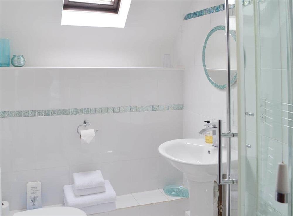 En-suite shower room with heated towel rail at Sunset, 