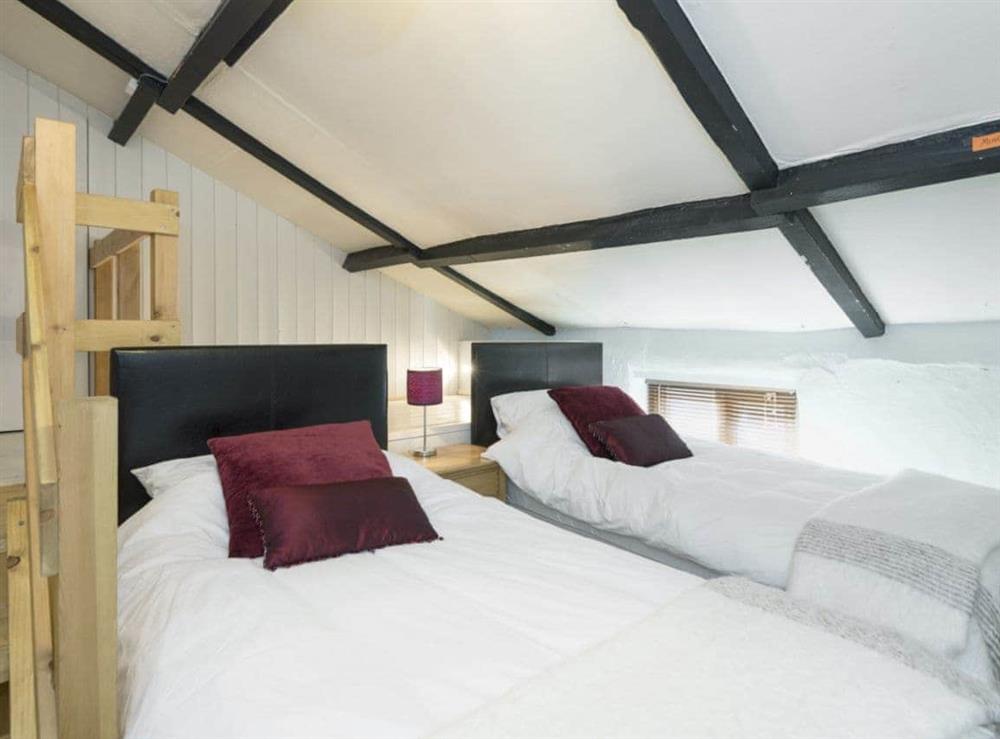Charming twin bedroom with beams at Horseshoes House in Saham Toney, Norfolk