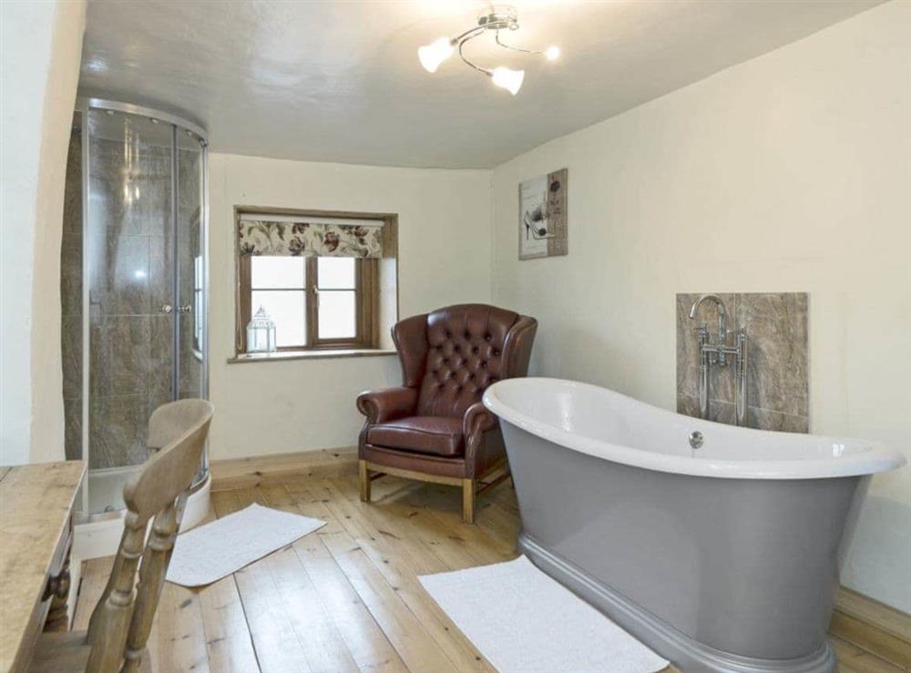 Sumptuous bathroom with  roll-top bath at Horseshoes House in Saham Toney, Norfolk