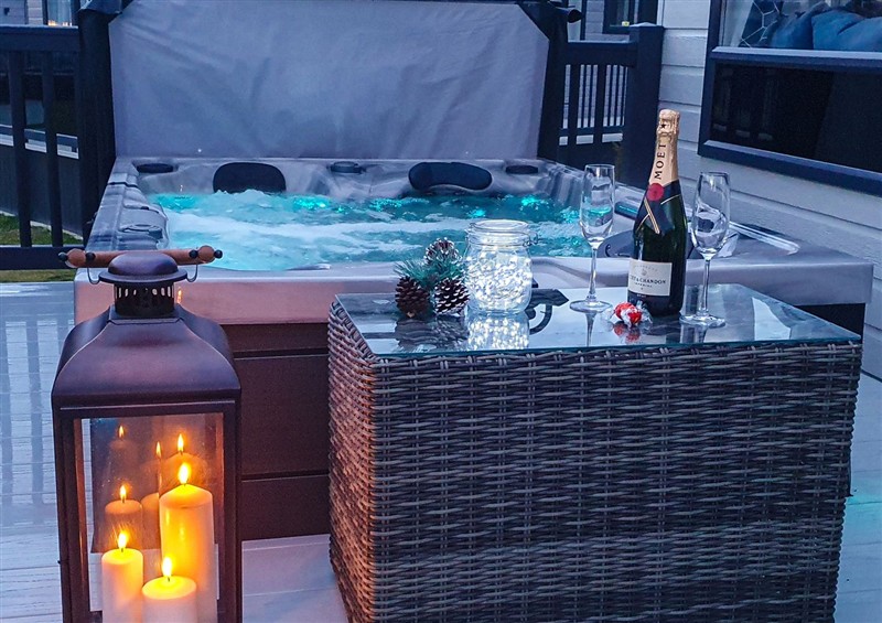Relax in the hot tub at Hotchkin Lodge, Woodhall Spa