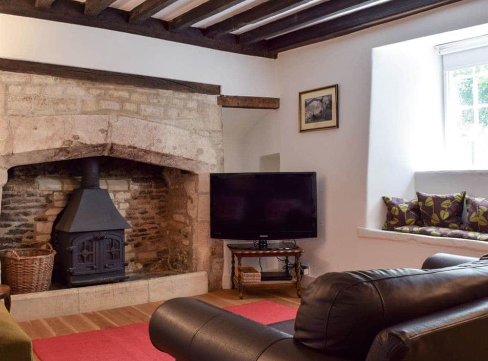 Cosy living room with wood burner at Hound Cottage in Burford, Oxfordshire., Great Britain