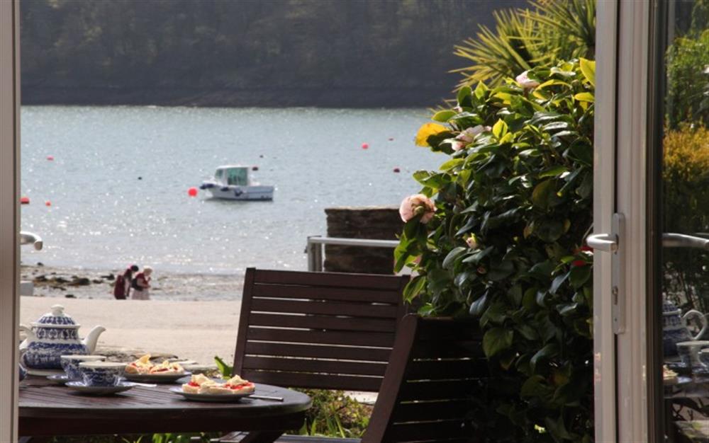 French doors open out to the patio and is just seconds from the beach. at Hove To in Helford Passage