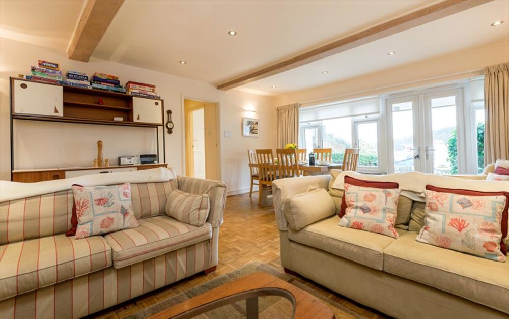 The lounge is very spacious with comfy sofas and beautiful wooden flooring. at Hove To in Helford Passage