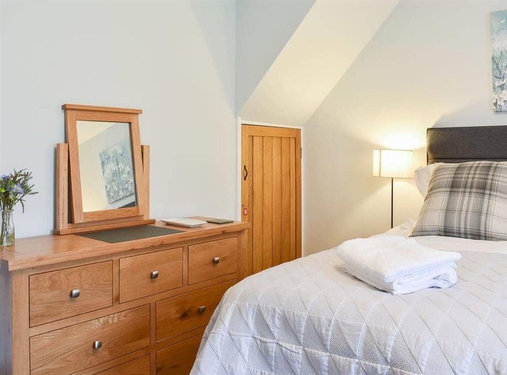 Attractive bedroom with pine furniture at Hovera in Glenridding, near Penrith, Cumbria