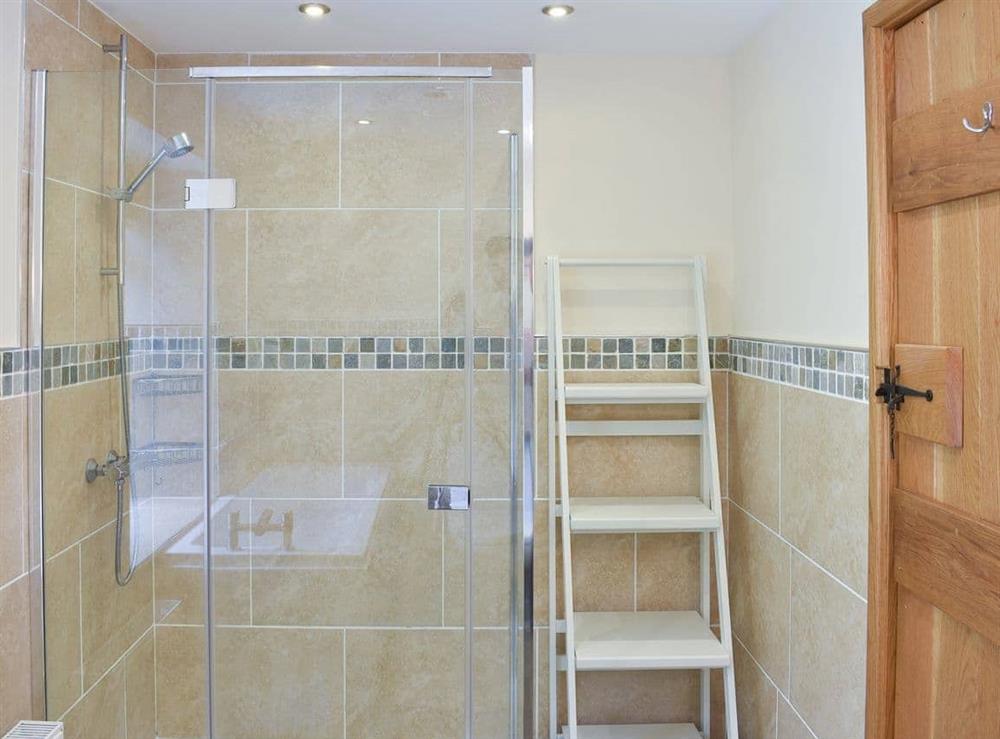 Bathroom with bath and shower cubicle at Hovera in Glenridding, near Penrith, Cumbria
