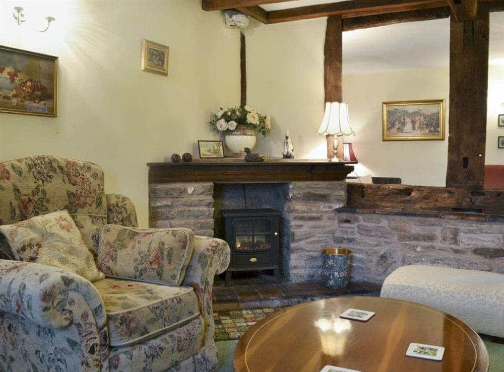 Homely living room with beams at Howards End in Middleton-on-the-Hill, near Leominster, Herefordshire