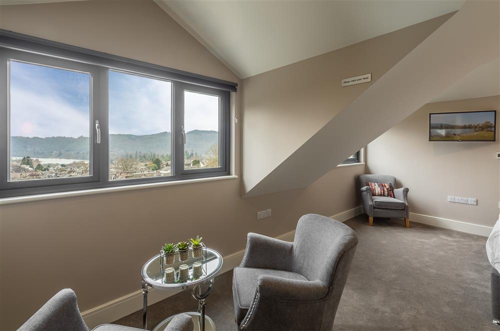 Bedroom five with far reaching views across to the lake at Howe Top, Bowness-On-Windermere