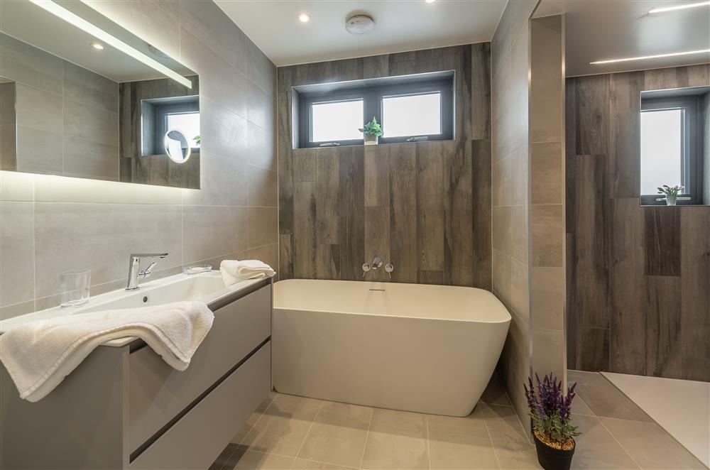 En-suite to bedroom one with free-standing bath and separate walk-in shower at Howe Top, Bowness-On-Windermere