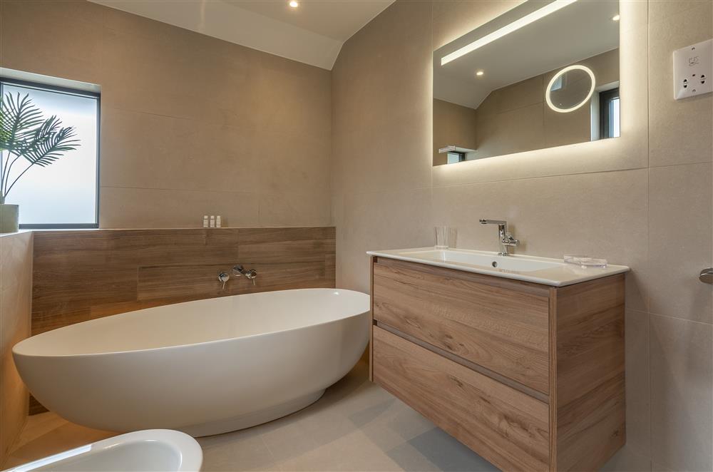 Family bathroom with free-standing bath and separate walk-in shower at Howe Top, Bowness-On-Windermere