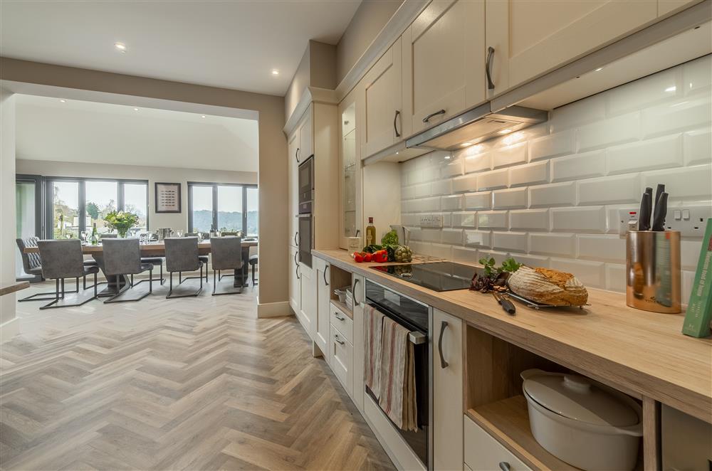 Open-plan layout from the kitchen leading through to the dining room at Howe Top, Bowness-On-Windermere