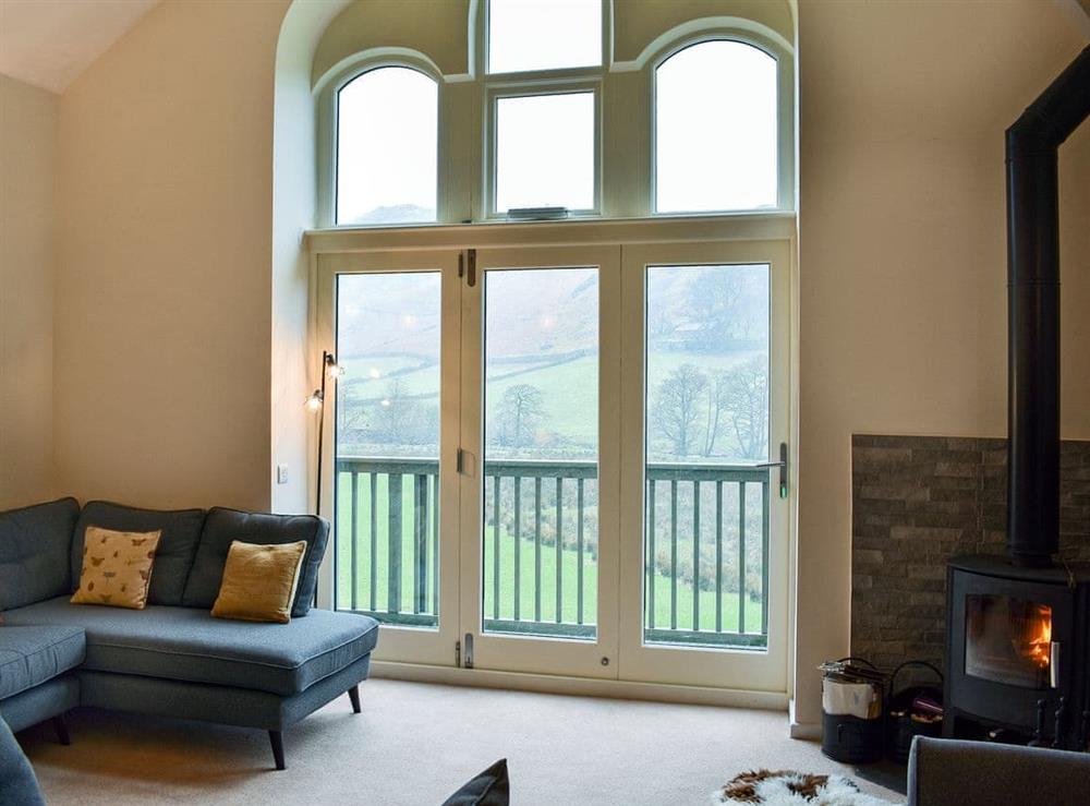 Homely living area with balcony (photo 2) at Howegrain Lodge in Pooley Bridge, near Ullswater, Cumbria