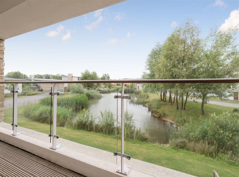 Balcony with lake view at Howells Mere in Somerford Keynes, Gloucestershire