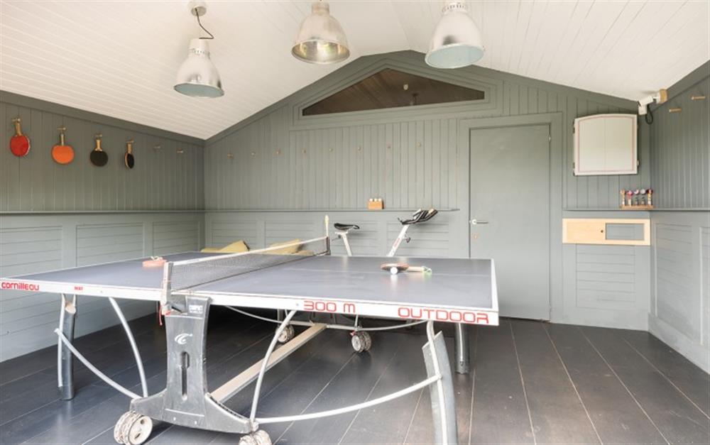 The games room with table tennis, dart board and spin bike! at Huccombe Farmhouse in Beesands