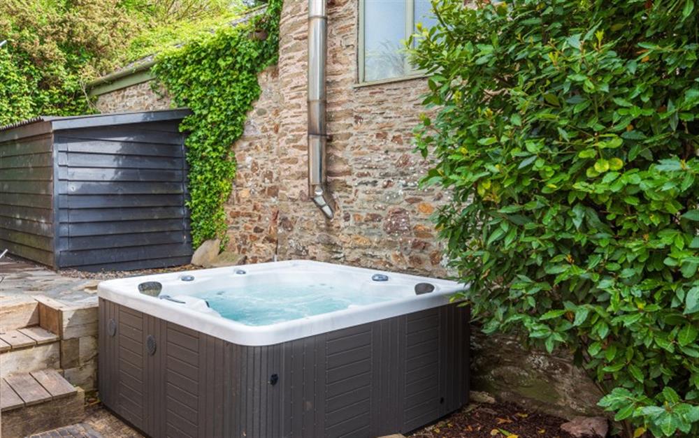 The hot tub, perfect for unwinding at the end of the day at Huccombe Farmhouse in Beesands