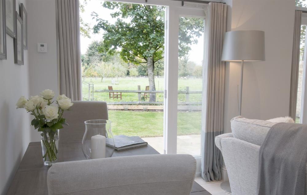 Sitting room opening out onto garden at Hunter Cottage, Clanfield