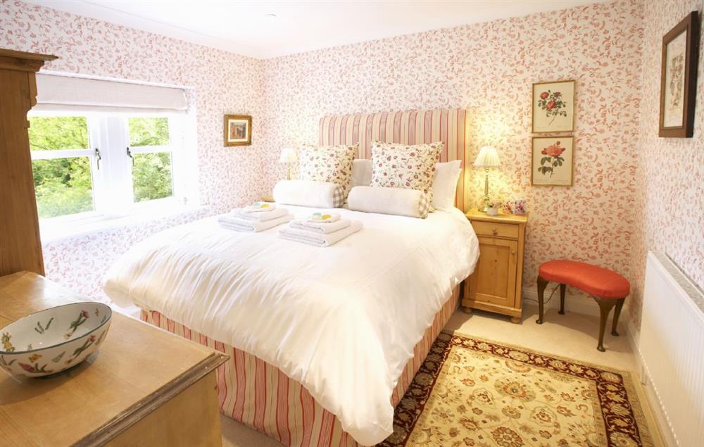 Bedroom three with a 5’ king-size bed at Hunter Court, Clanfield