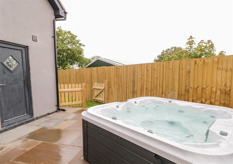 There is a hot tub at Hunters Cottage, Tyn-y-Gongl near Benllech