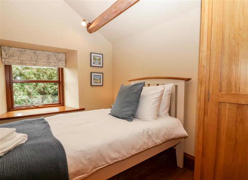 A bedroom in Huntsmans Cottage at Huntsmans Cottage, Broughton Beck near Ulverston