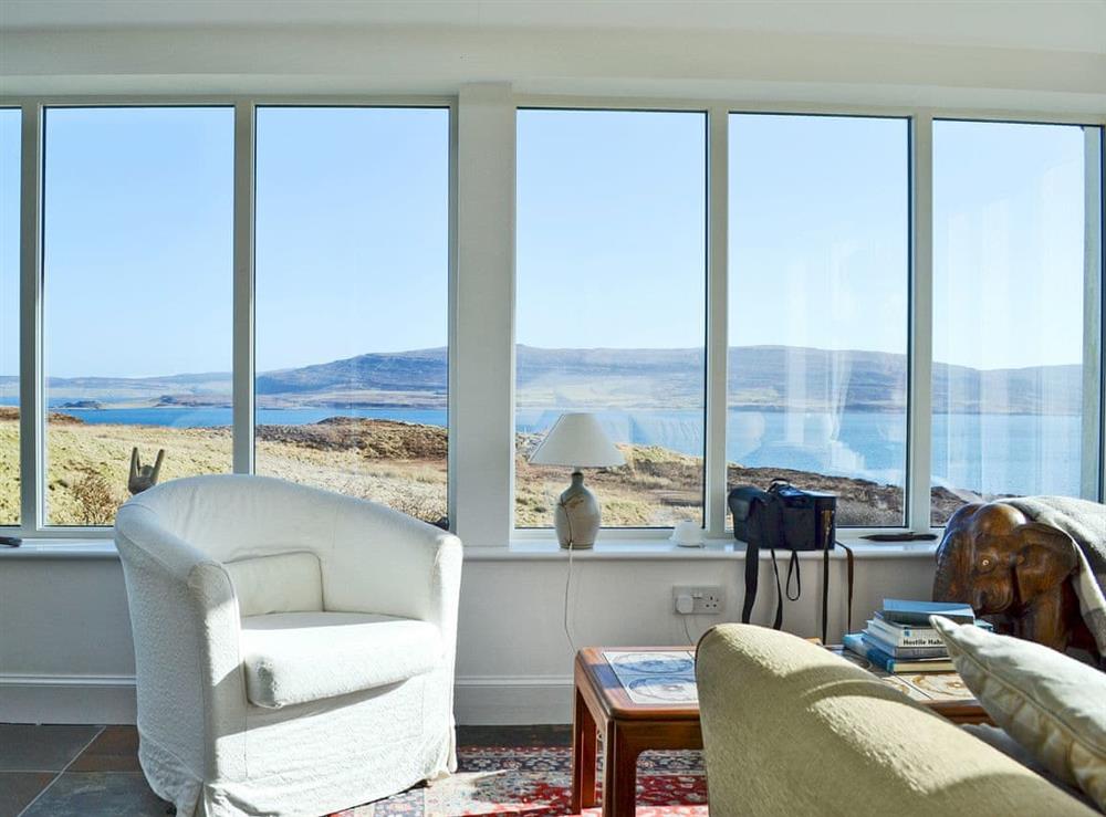 Light and airy living room with stunning views (photo 2) at Husabost Croft in Husabost, Isle Of Skye