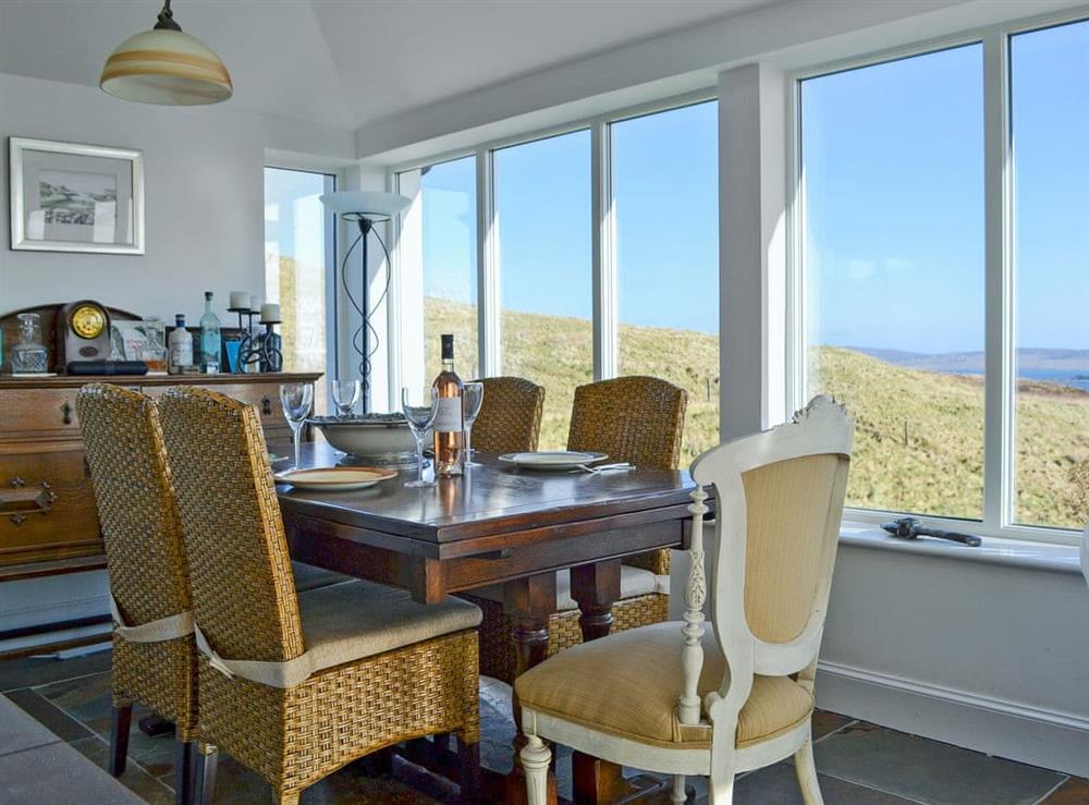 Sociable dining area with amazing views at Husabost Croft in Husabost, Isle Of Skye