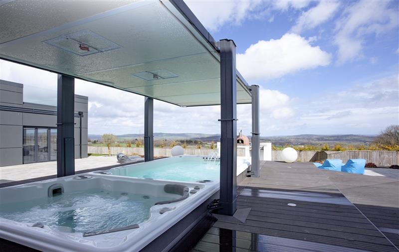 Spend some time in the hot tub at Huxham View, Devon
