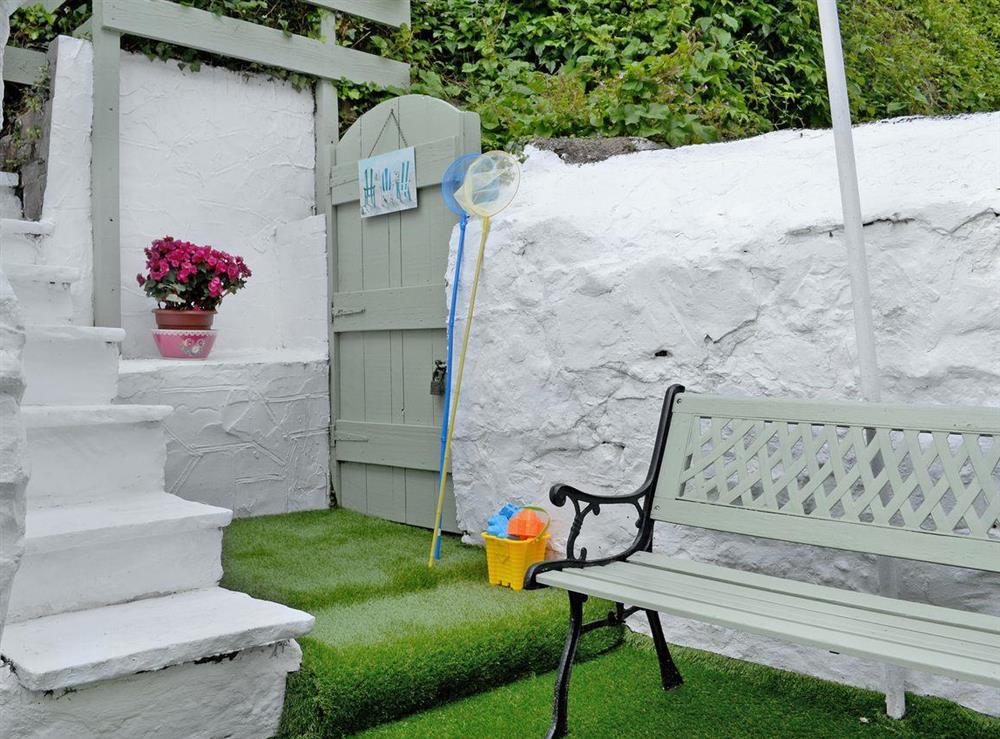 Relaxing courtyard with garden furniture (photo 3) at Hyfrydle in Llandudno, Gwynedd