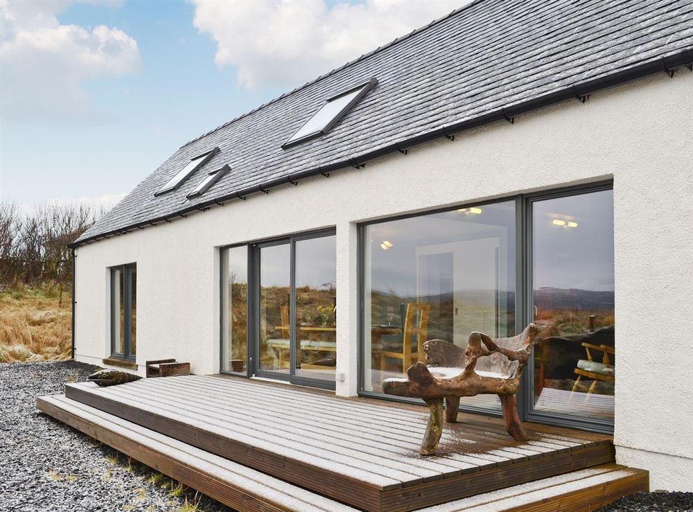 Exterior with patio doors leading onto decking at Hygge in Isle of Skye, Isle Of Skye