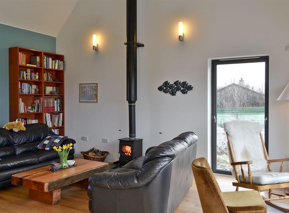 Open plan style Living room with wood burning stove at Hygge in Isle of Skye, Isle Of Skye