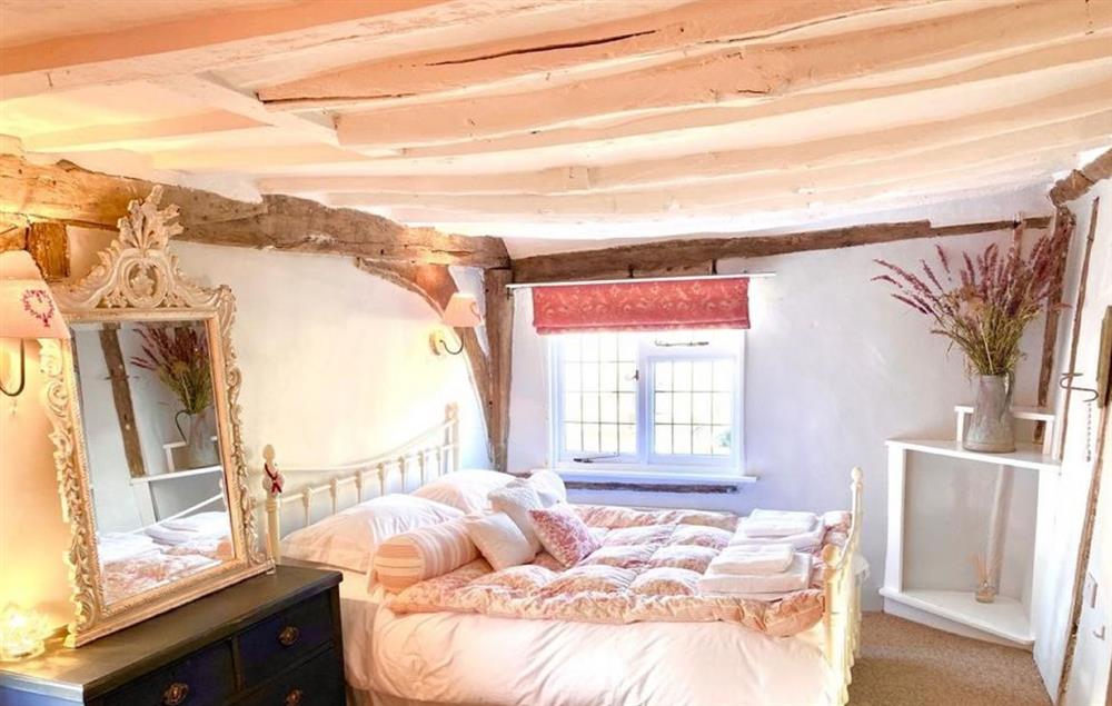 Bedroom with 5’ king size bed and exposed beams (photo 2) at Hylton Cottage, Lavenham
