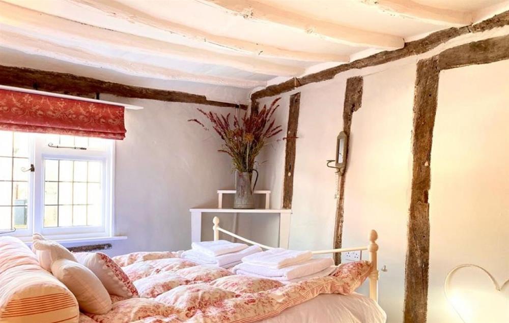Hylton Cottage retains much of its original charm with exposed beams at Hylton Cottage, Lavenham